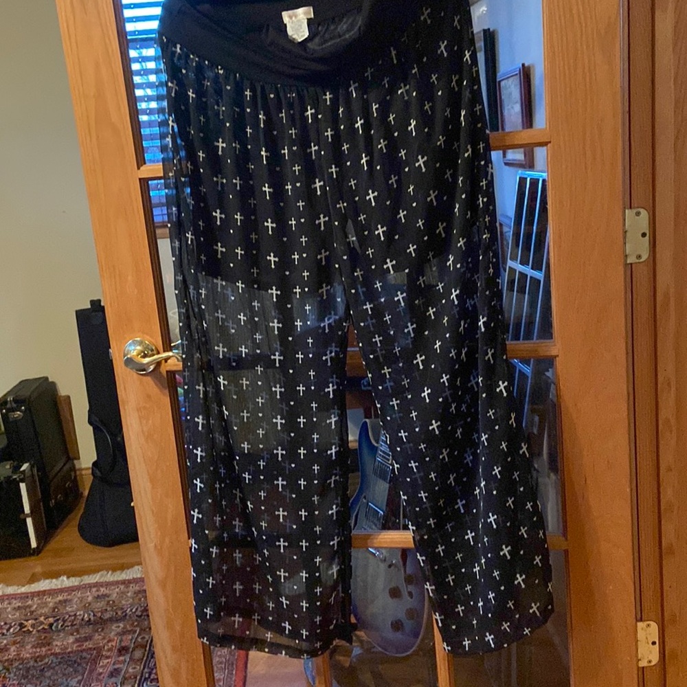 Wide legged pants shear with short below with white crosses